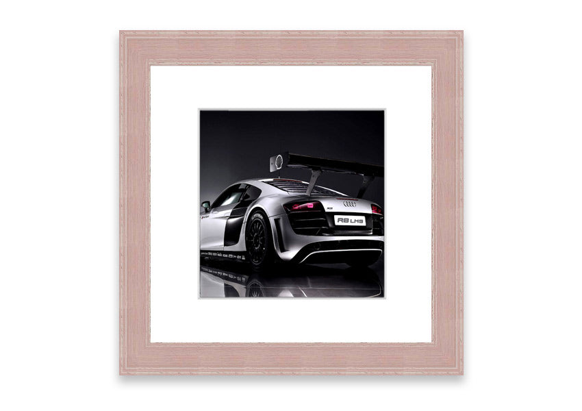 Framed print of the 2010 Audi R8 Lms, showcasing its sleek design and vibrant colors, ready to hang.