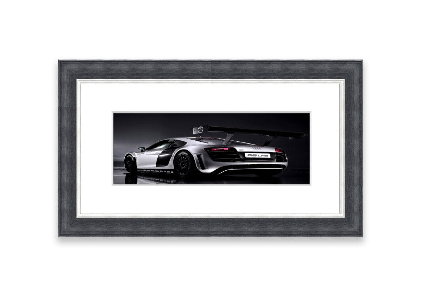 Framed print of the 2010 Audi R8 Lms, showcasing its sleek design and vibrant colors, ready to hang.