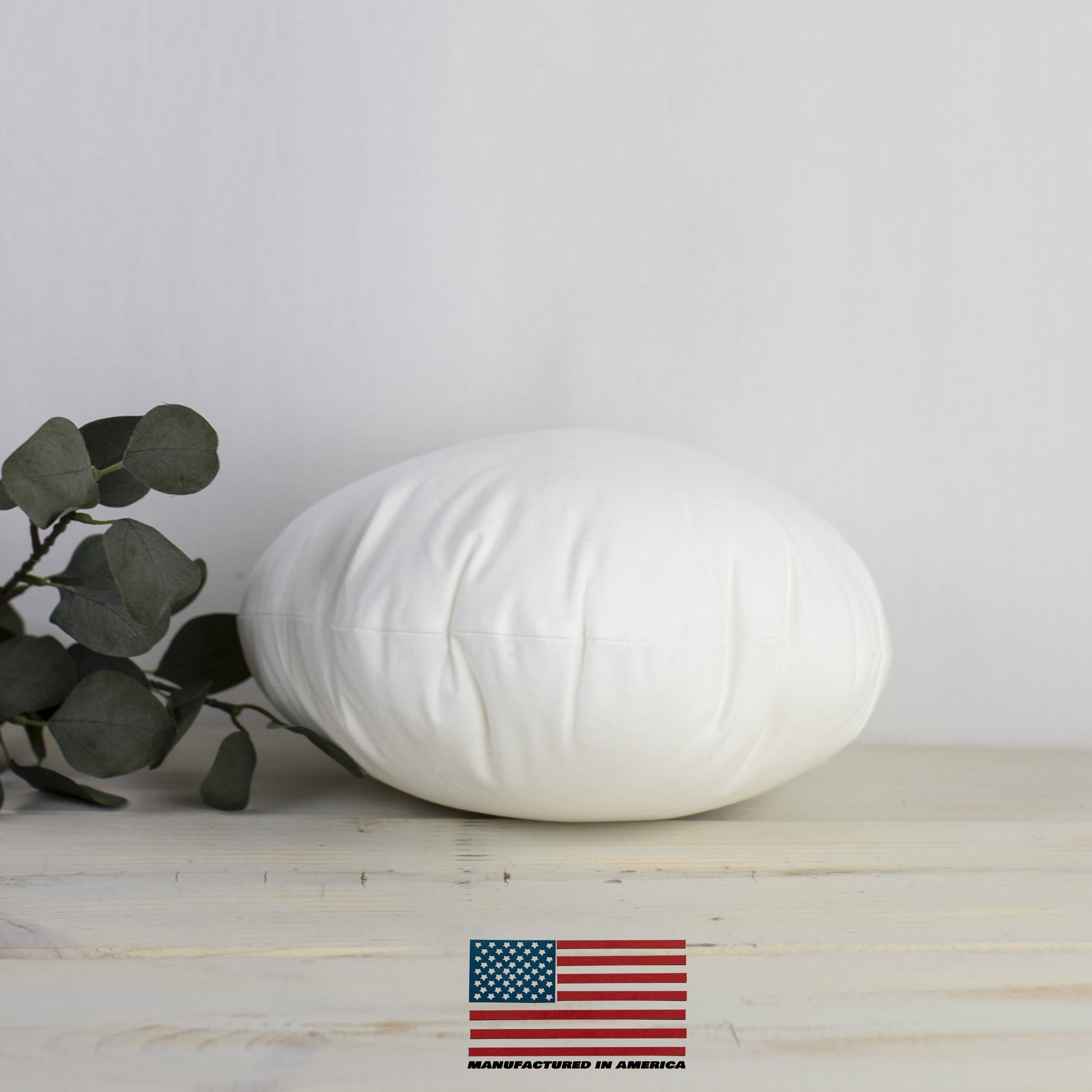 A 23-inch round pillow insert made of hypoallergenic polyester, featuring a durable woven cotton blend outer shell, ideal for indoor and outdoor use.