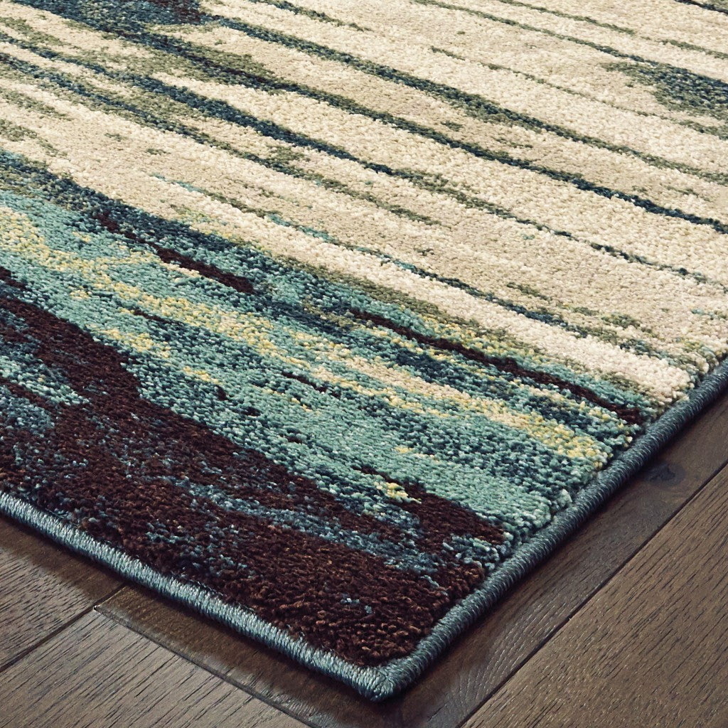 Ivory Blue Gray Abstract Layers Indoor Accent Rug, featuring a modern abstract design with soft high-pile texture.