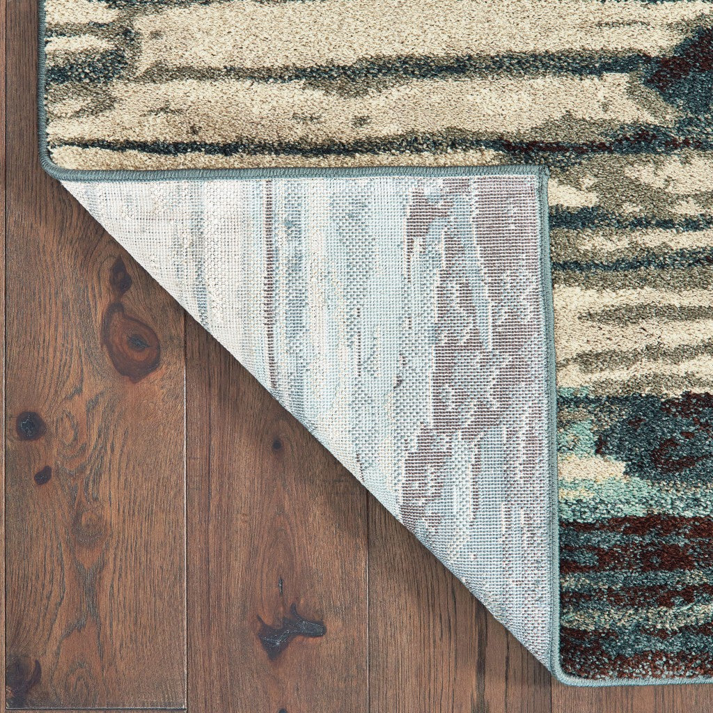 Ivory Blue Gray Abstract Layers Indoor Accent Rug, featuring a modern abstract design with soft high-pile texture.