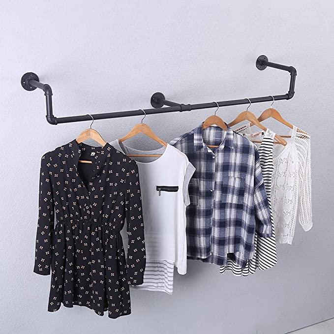 39in Black Industrial Pipe Clothing Rack mounted on a wall, showcasing stylish clothing and accessories.