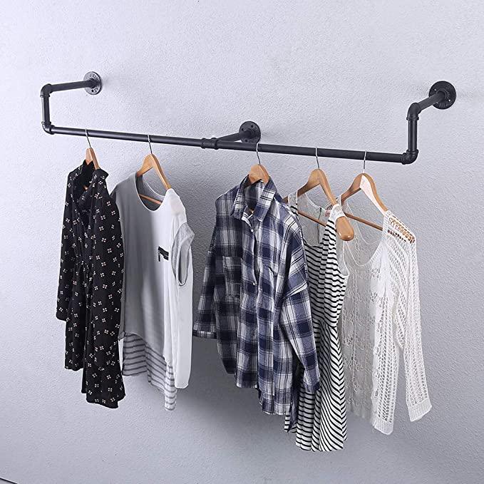 39in Black Industrial Pipe Clothing Rack mounted on a wall, showcasing stylish clothing and accessories.