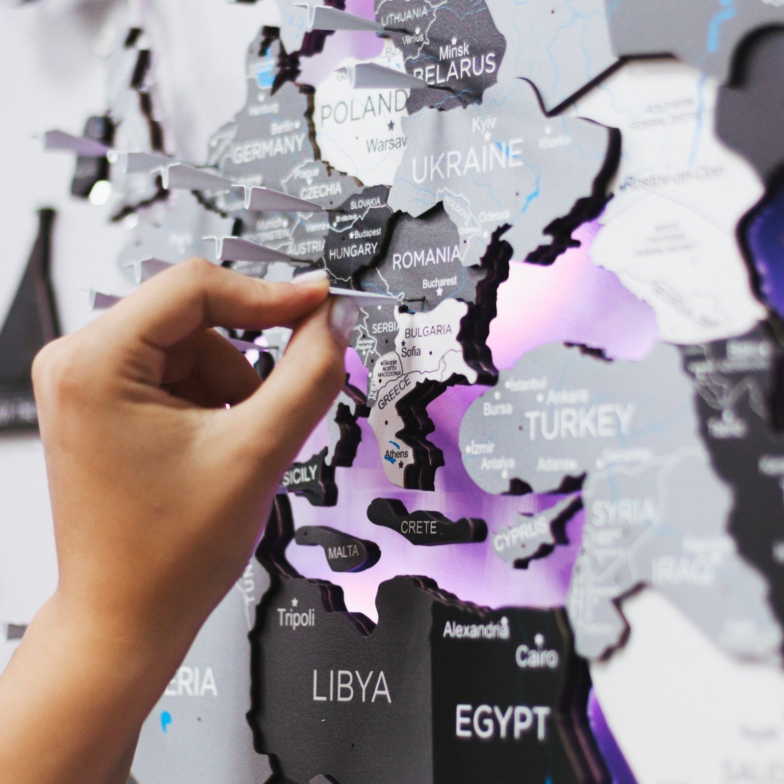 3D LED Wooden World Map Nordik displayed on a wall, showcasing intricate details and vibrant LED lighting.