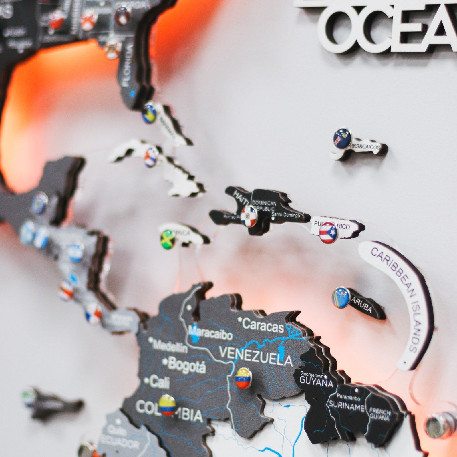3D LED Wooden World Map Nordik displayed on a wall, showcasing intricate details and vibrant LED lighting.