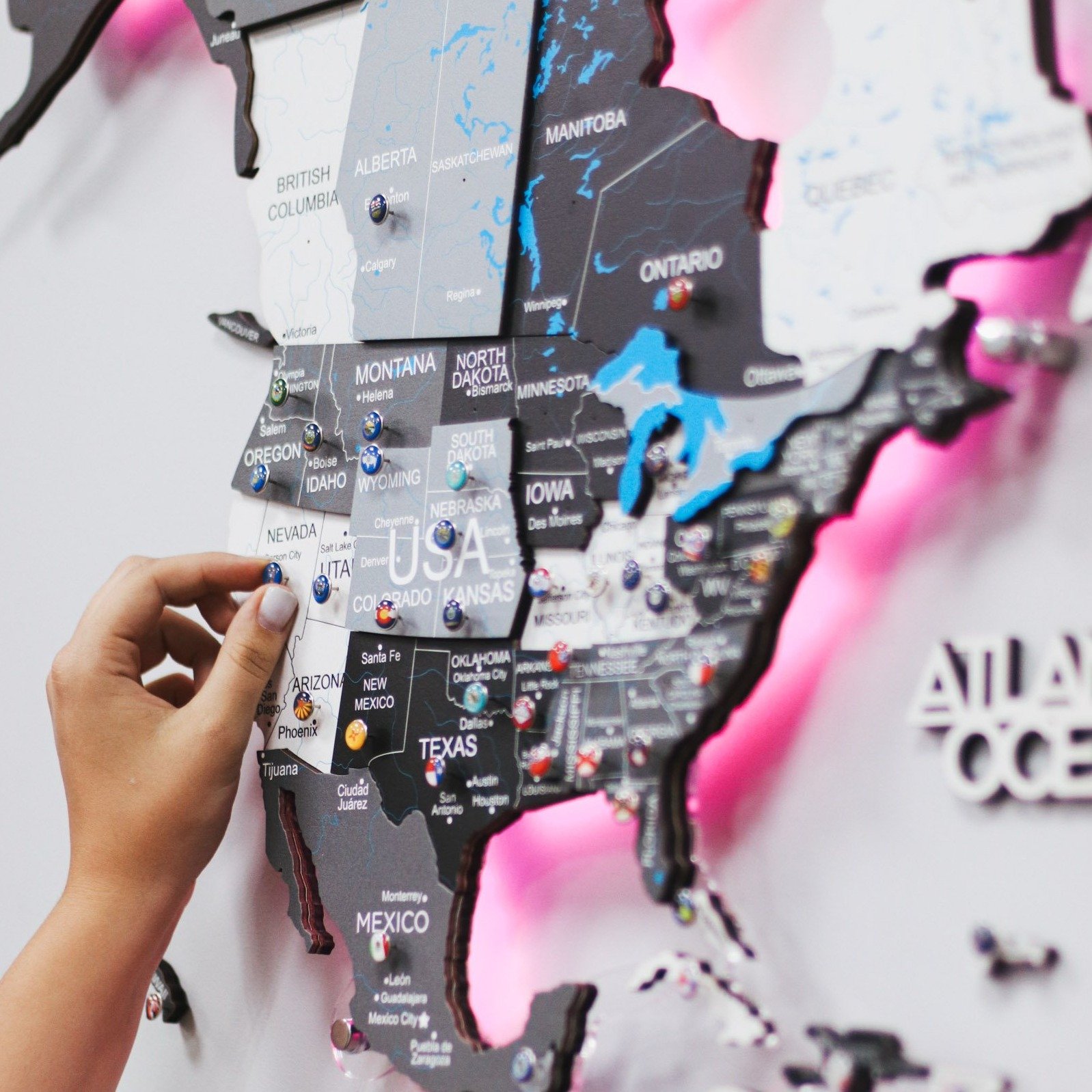 3D LED Wooden World Map Nordik displayed on a wall, showcasing intricate details and vibrant LED lighting.