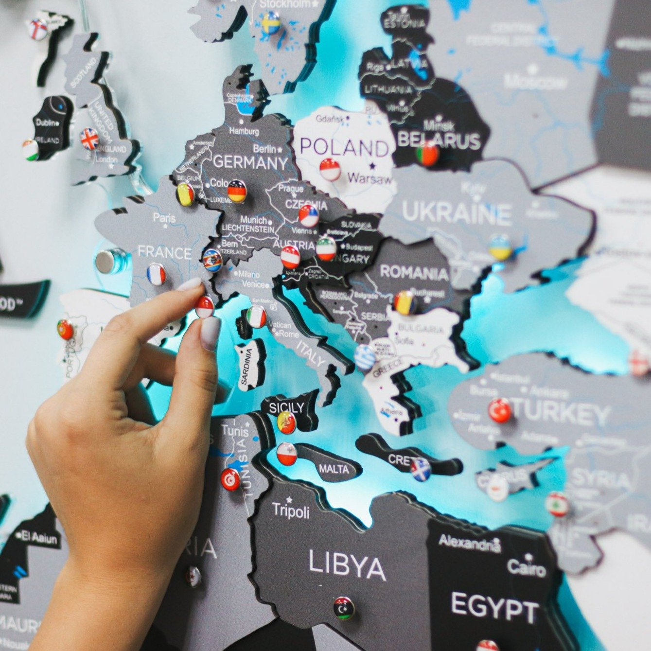 3D LED Wooden World Map Nordik displayed on a wall, showcasing intricate details and vibrant LED lighting.