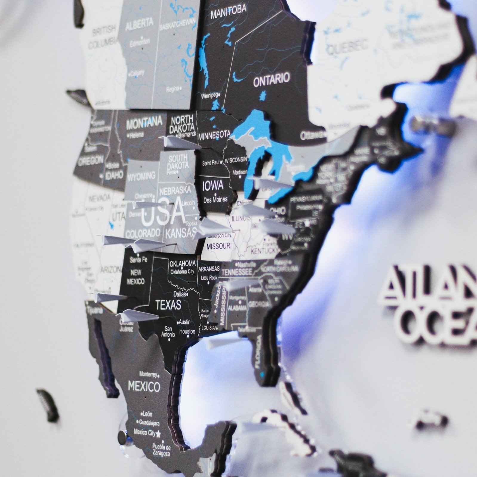 3D LED Wooden World Map Nordik displayed on a wall, showcasing intricate details and vibrant LED lighting.
