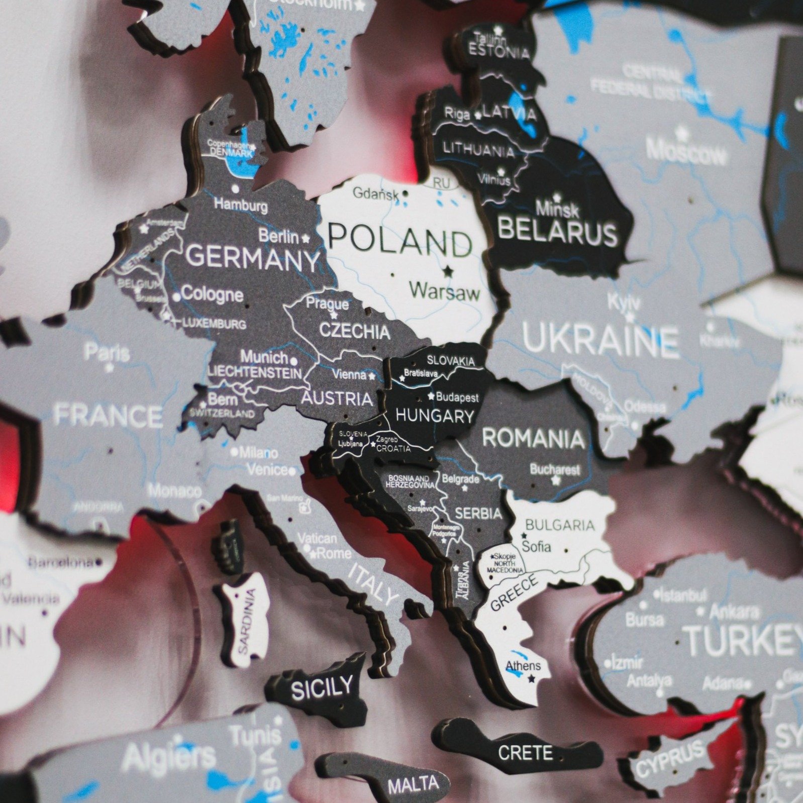 3D LED Wooden World Map Nordik displayed on a wall, showcasing intricate details and vibrant LED lighting.