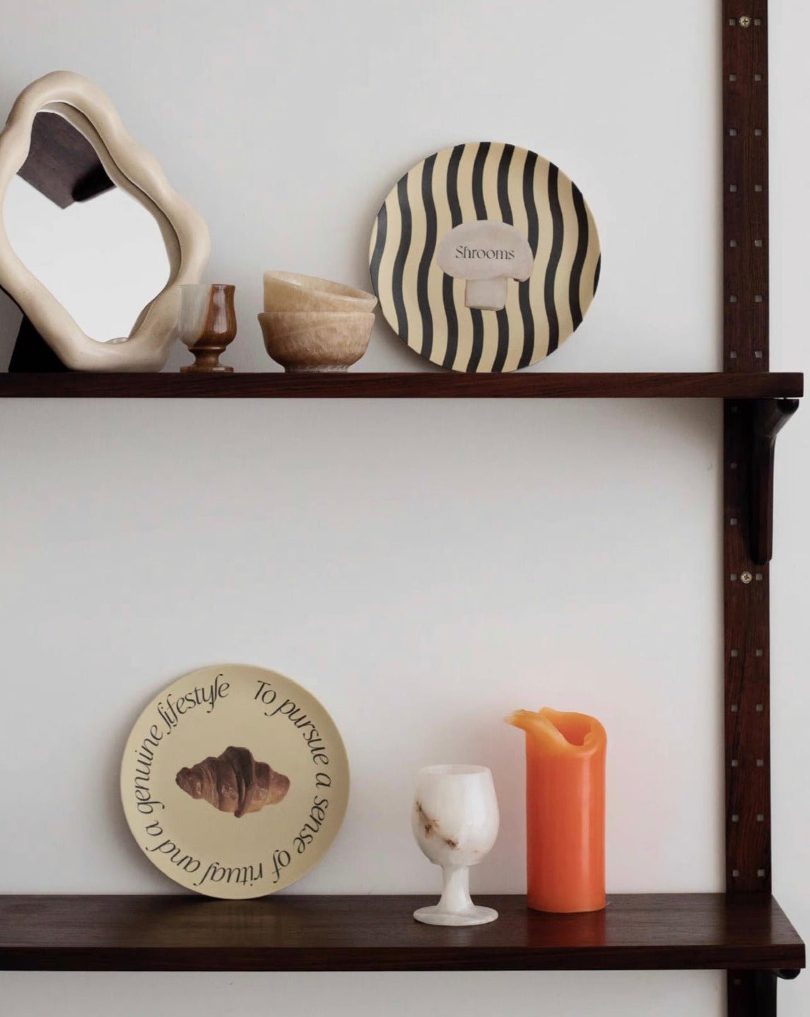 A set of four modern bamboo fiber plates featuring mushroom and croissant prints, showcasing eco-friendly design and vibrant colors.