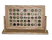 A stylish 45 Challenge Coin Rack Display featuring an acrylic front and blue backing, holding various challenge coins.