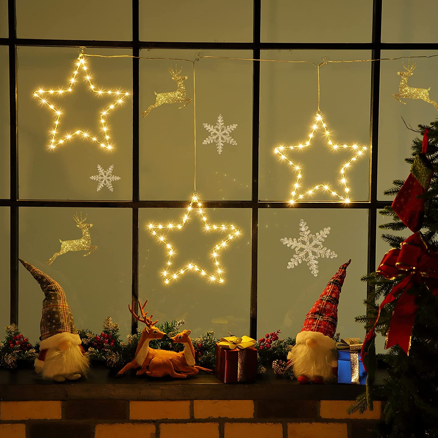 Five packs of LED Christmas window star lights featuring three metal stars with 60 energy-saving LED lights, perfect for holiday decorations.