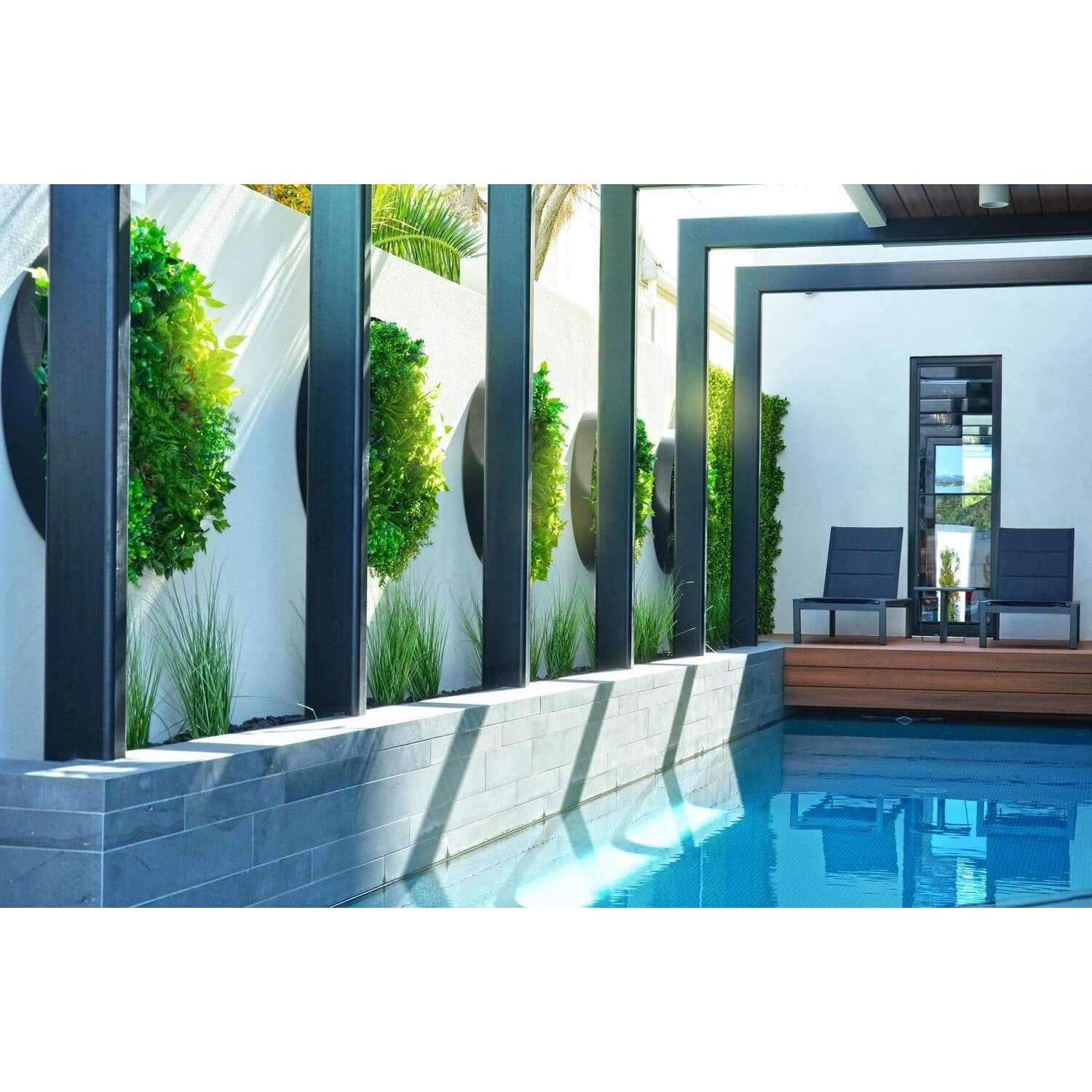 80cm Colour Splash Artificial Vertical Garden Wall Art Disc featuring vibrant tropical plants and a touch of red in a black frame.