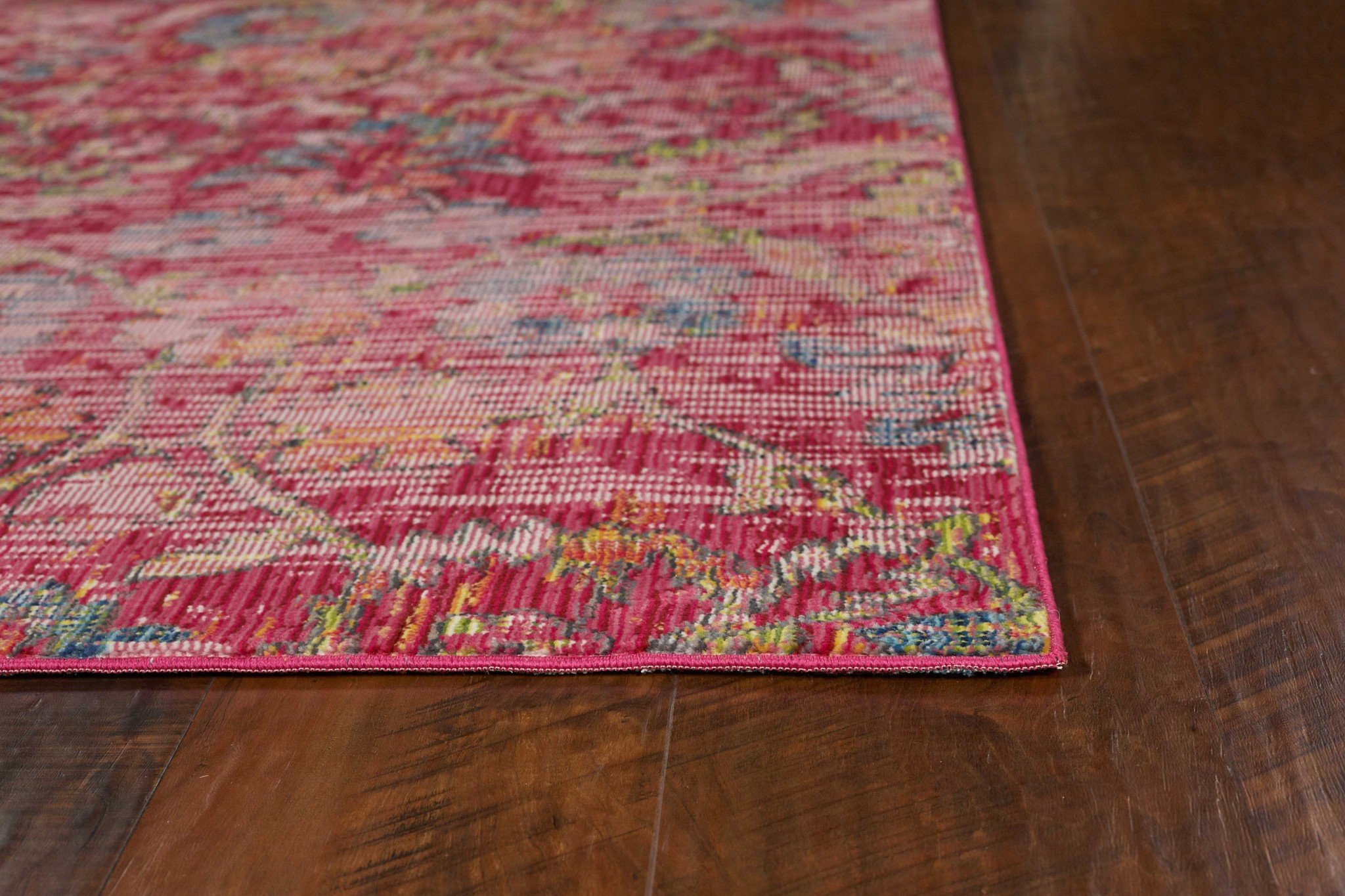 A large teal polypropylene rug measuring 94" X 134", featuring vintage traditional design with distressed patterns.