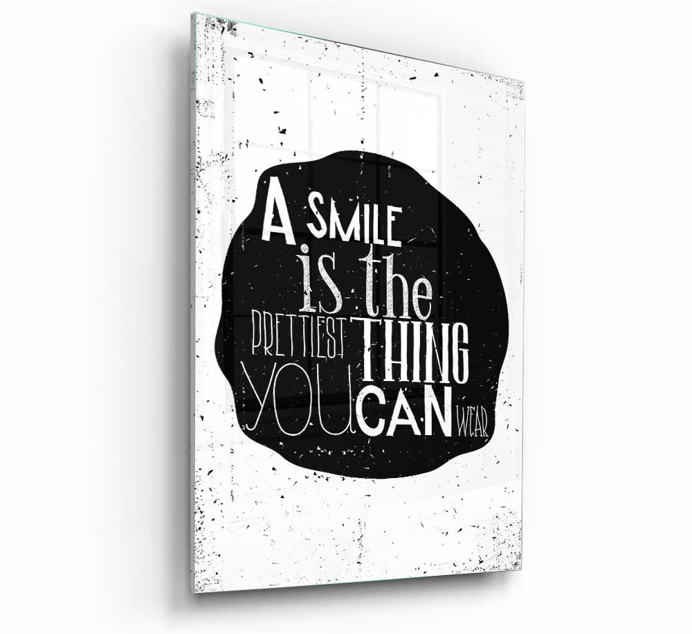 A modern glass print featuring the quote 'A Smile Is The Prettiest Thing', showcasing vibrant colors and elegant design.