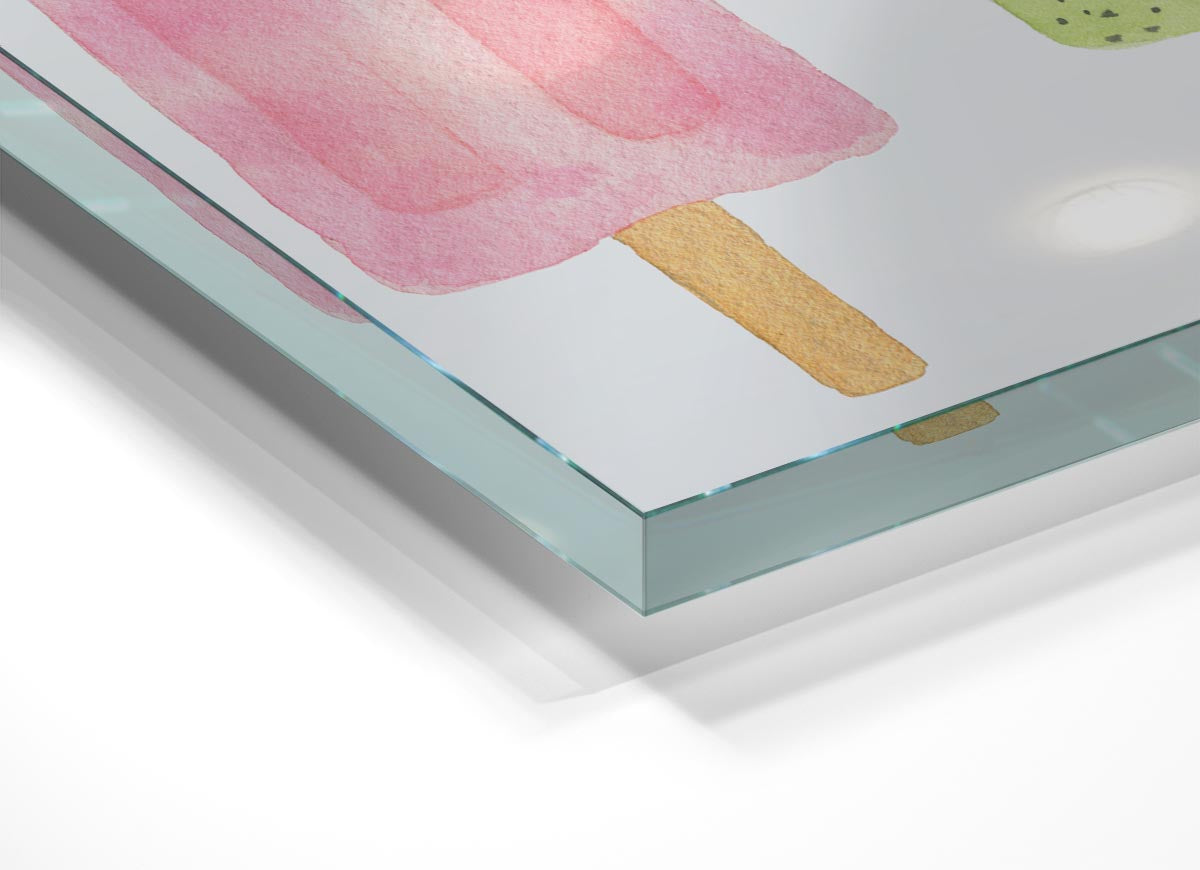 A modern glass print featuring a colorful trio of lollies, perfect for home decor.