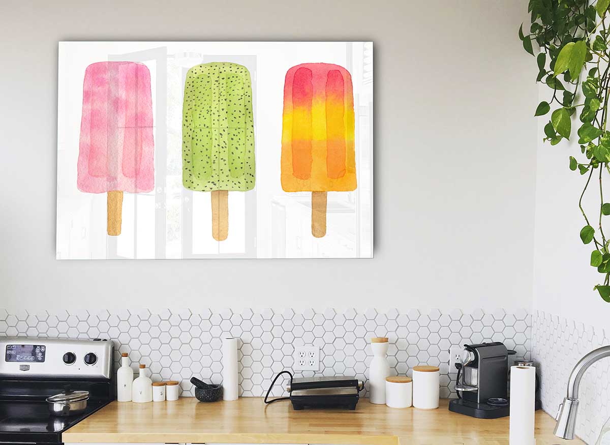 A modern glass print featuring a colorful trio of lollies, perfect for home decor.