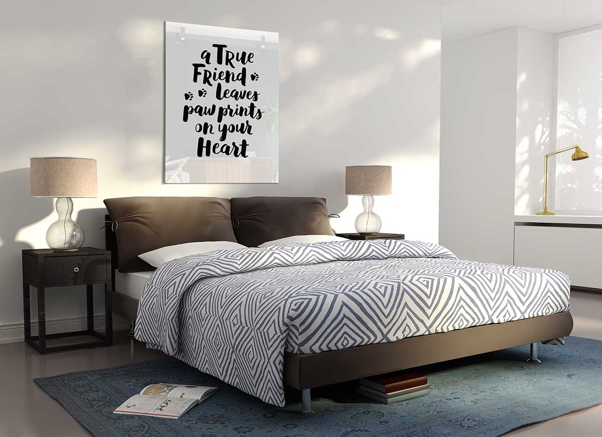 A modern glass print featuring the phrase 'A True Friend Leaves Paw Prints' with paw prints design, perfect for pet lovers.