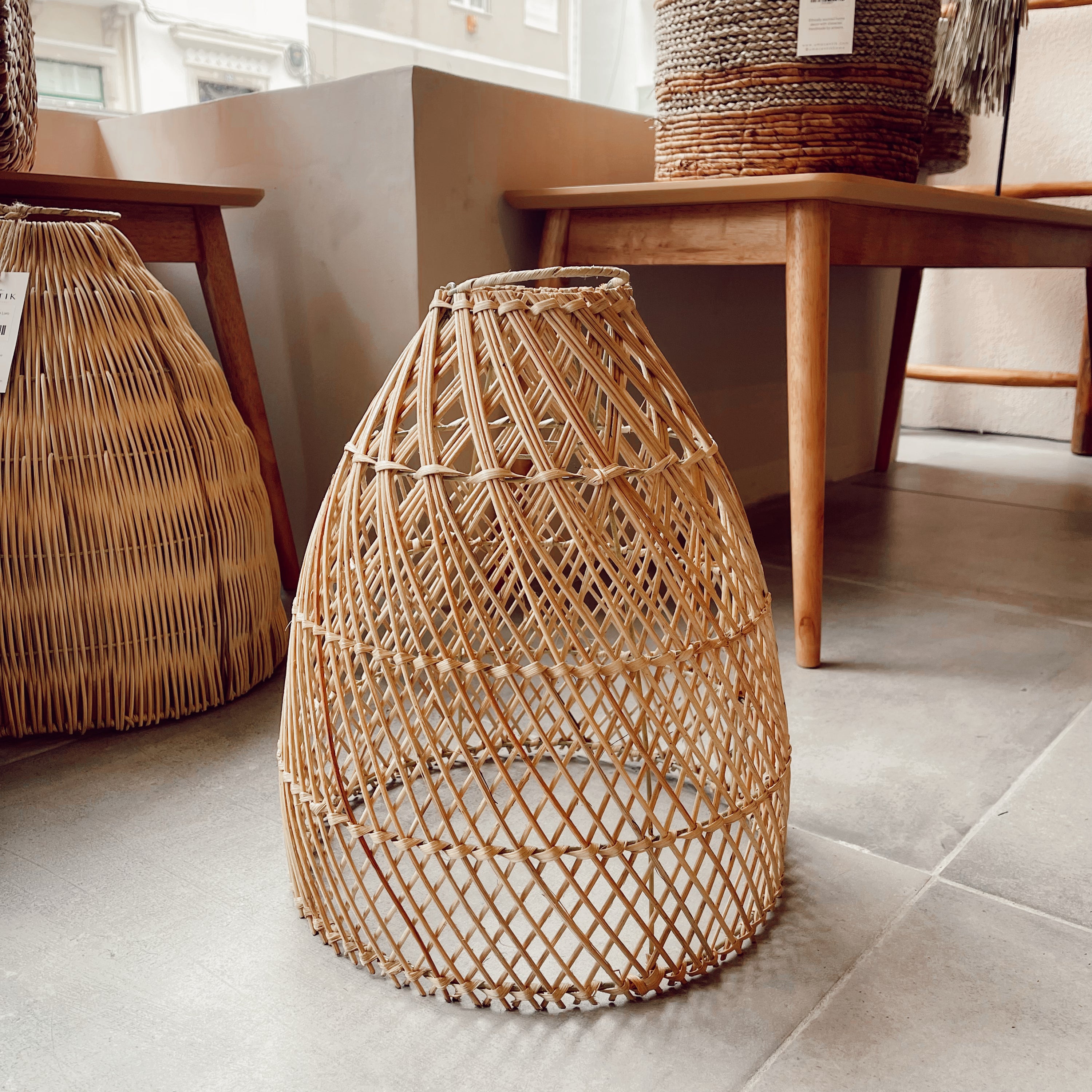 Laga Natural Rattan Lampshade hanging elegantly, showcasing intricate weaving and a boho style.