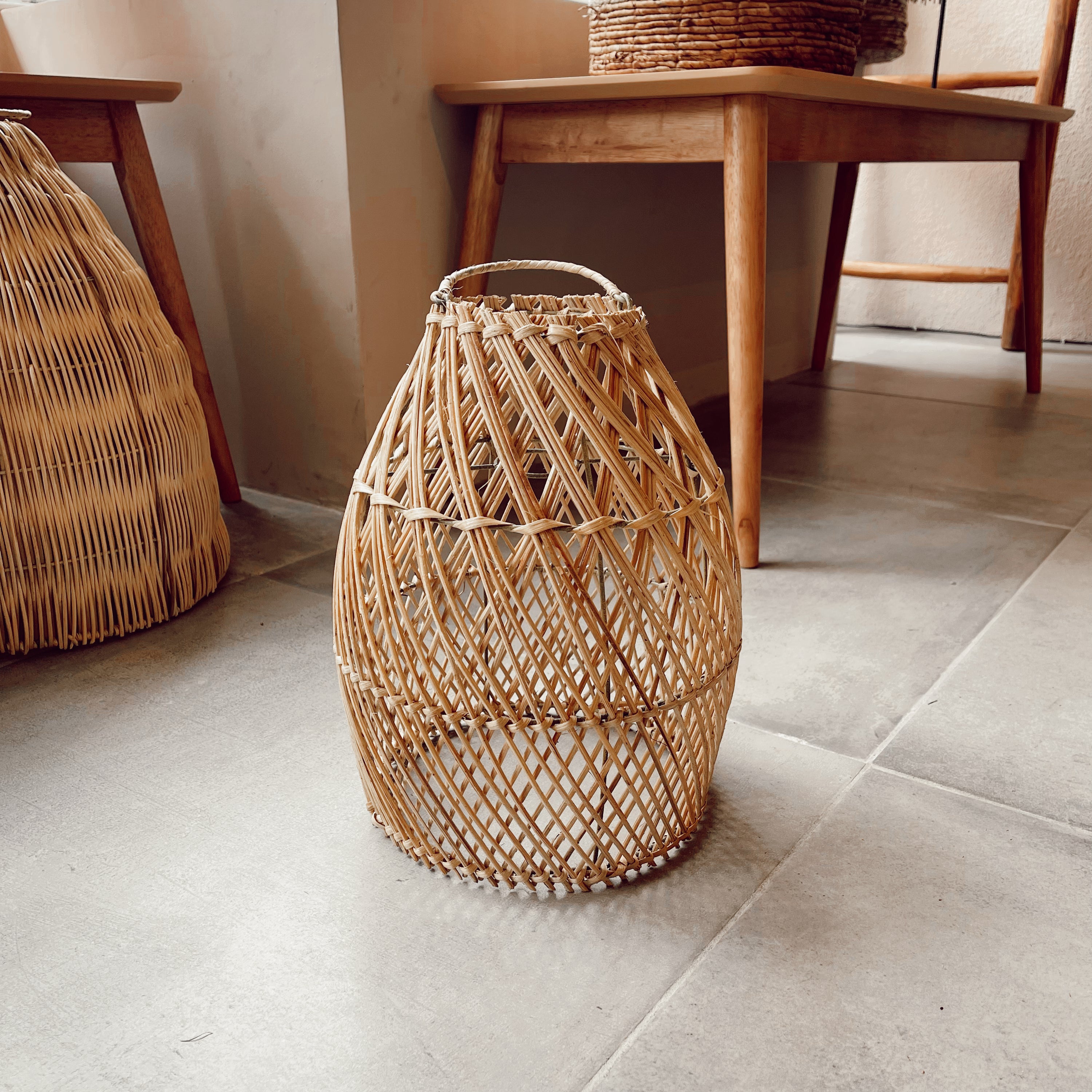 Laga Natural Rattan Lampshade hanging elegantly, showcasing its intricate design and natural texture.