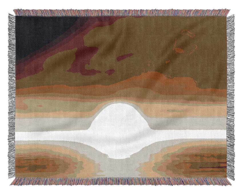 A luxurious Abstract Sun Beige throw blanket made from 100% cotton, featuring a thermal weave for breathability, draped elegantly over a couch.