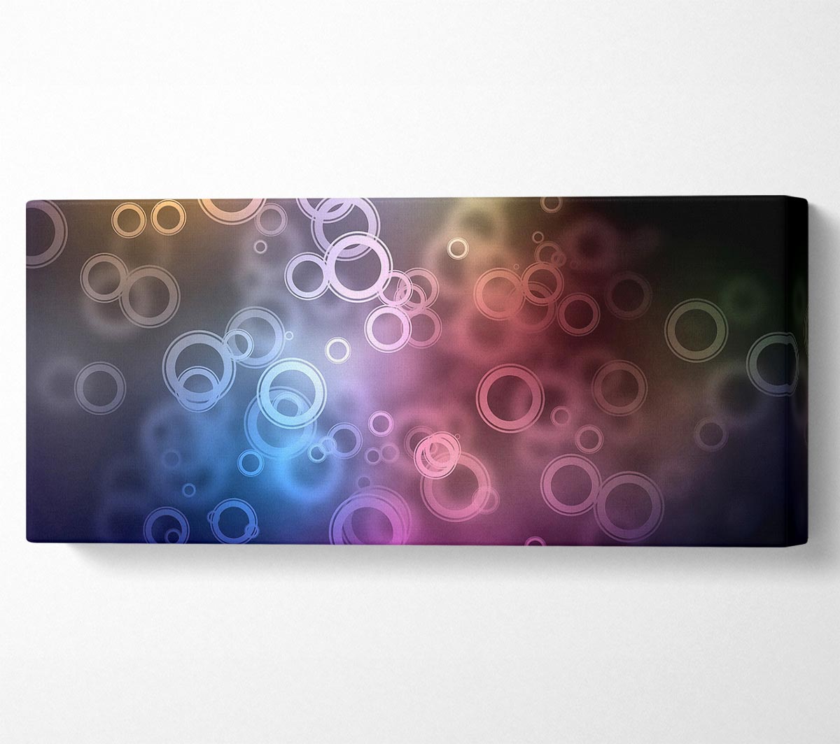 A vibrant abstract circle art piece printed on coated polyester canvas, mounted on a sturdy 44mm box frame, ready to hang.