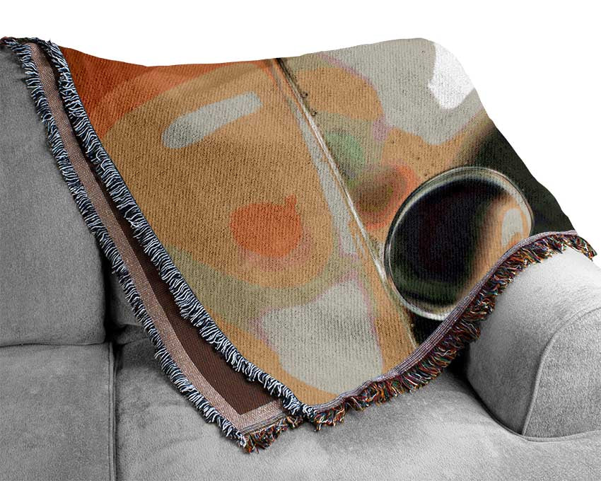 A luxurious Abstract Circles Droplets throw blanket made from 100% cotton, featuring an elegant abstract circle design in soft colors.