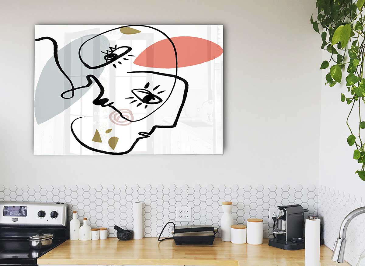 A modern glass print featuring abstract line drawings of faces, showcasing elegant and minimalist design.