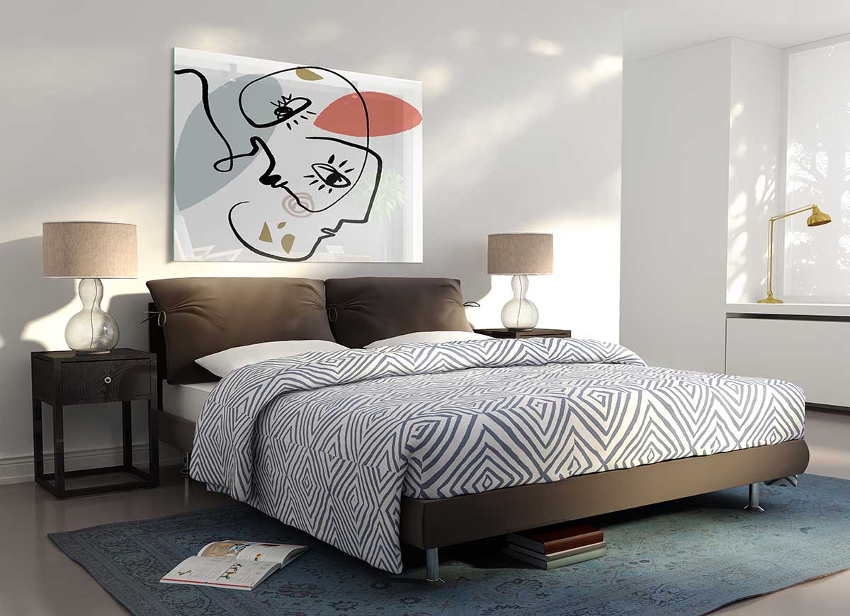 A modern glass print featuring abstract line drawings of faces, showcasing elegant and minimalist design.