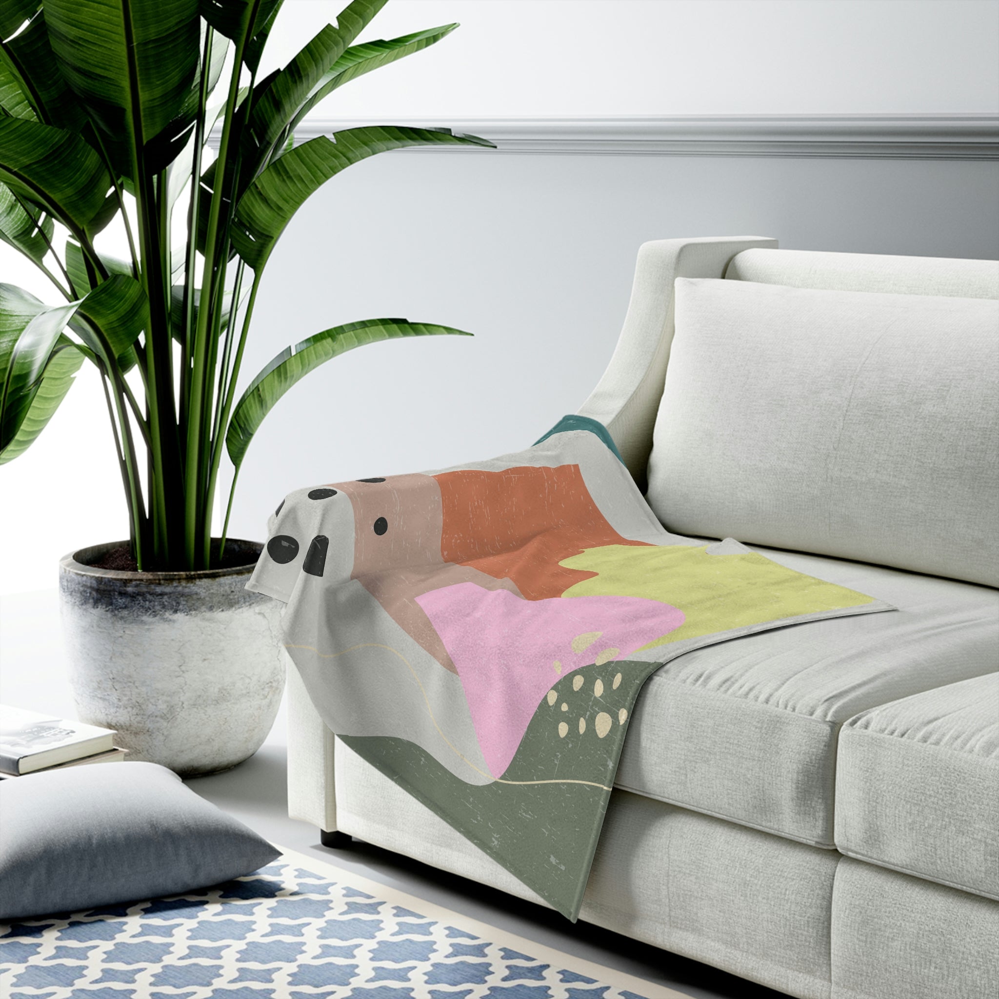 A cozy Abstract Vase Blanket Plush Throw in soft velveteen fabric, showcasing a modern abstract design, perfect for home decor.