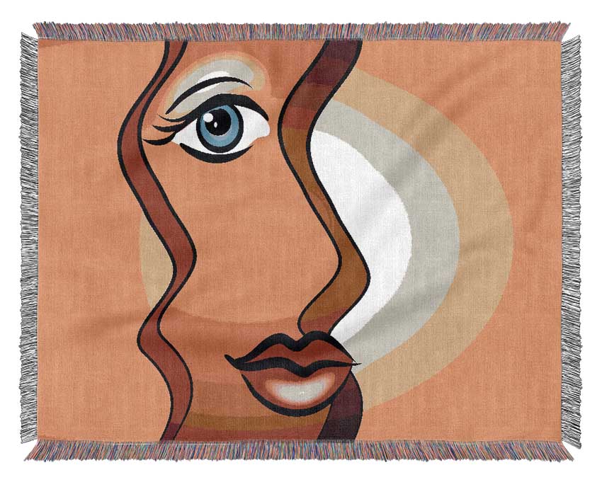 A luxurious Abstract Woman throw blanket made from 100% cotton, featuring a thermal weave design, elegantly draped over a couch.