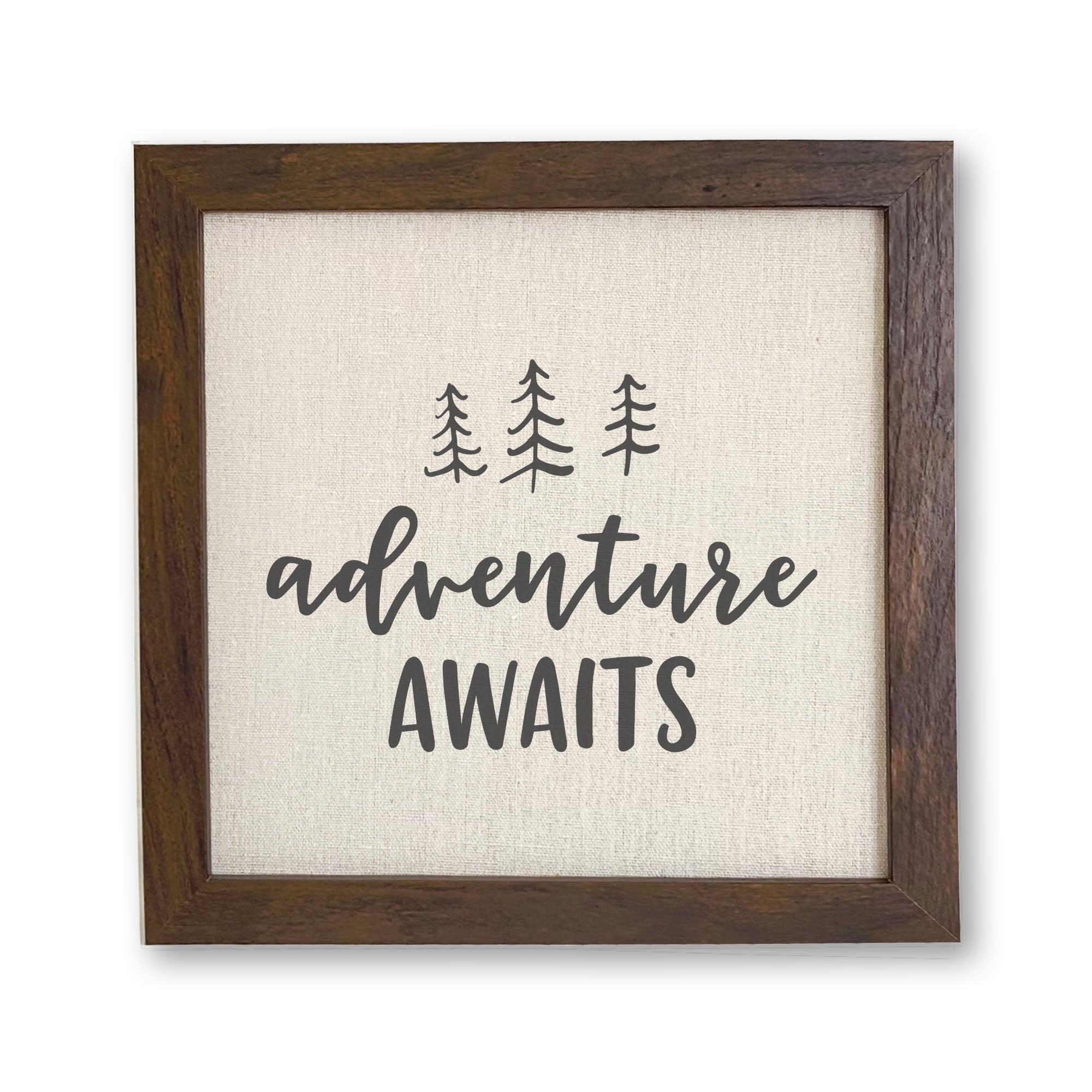 Adventure Awaits framed sign with a wood frame and linen-look background, featuring nature-inspired design.
