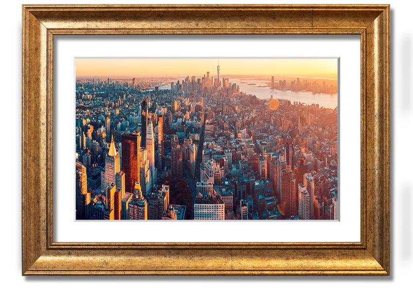 Aerial view of a city at sunset, framed print with vibrant colors and intricate details, ready to hang.