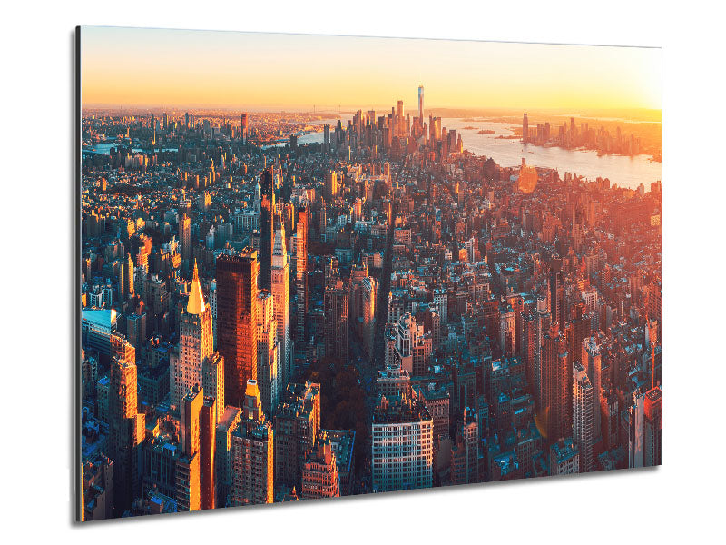Aerial view of a city at sunset, printed on brushed aluminium dibond, showcasing vibrant colors and modern design.