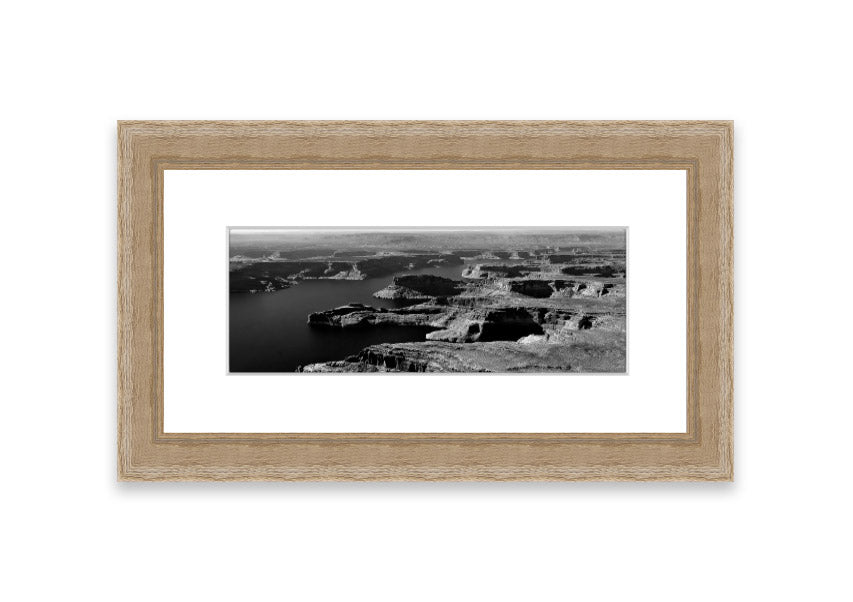 Framed print of an aerial view of a canyon in Cornwall, showcasing vibrant colors and intricate details.