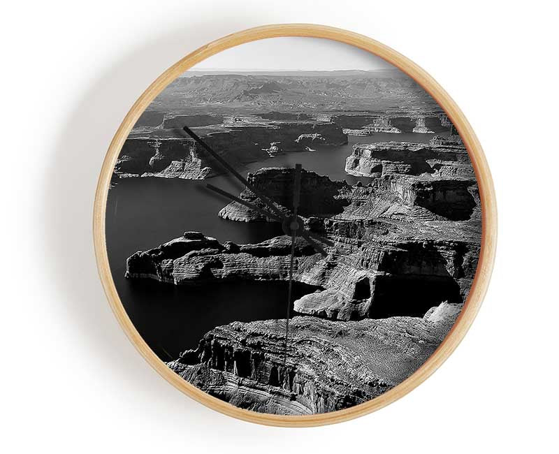 Aerial View Of Canyon clock made from natural bamboo with a round face and clear Plexiglas lens, available in black, white, and natural frame colors.