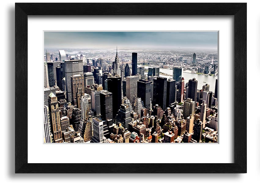 Framed print of an aerial view of New York City showcasing the skyline and urban landscape.