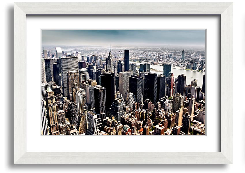 Framed print of an aerial view of New York City showcasing the skyline and urban landscape.