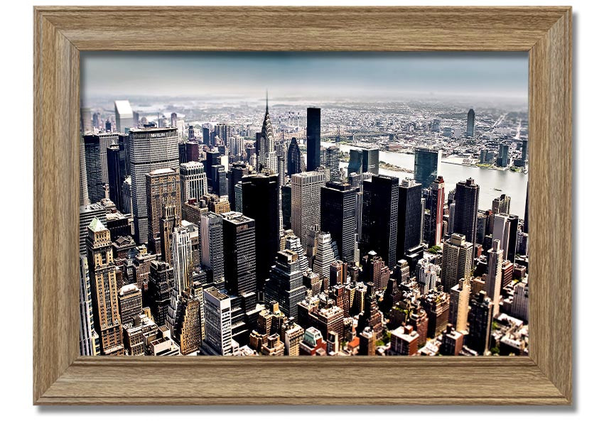 Framed print of an aerial view of New York City showcasing the skyline and urban landscape.