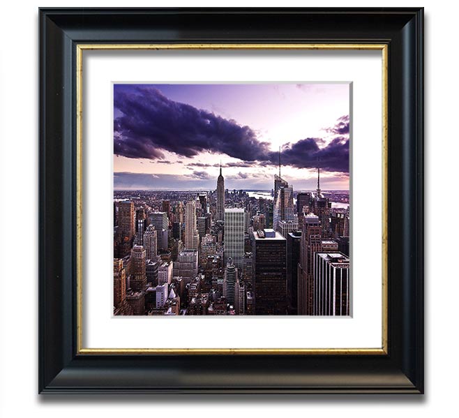 Aerial view of New York City skyline at dusk, framed in a stylish square frame, showcasing vibrant city lights.