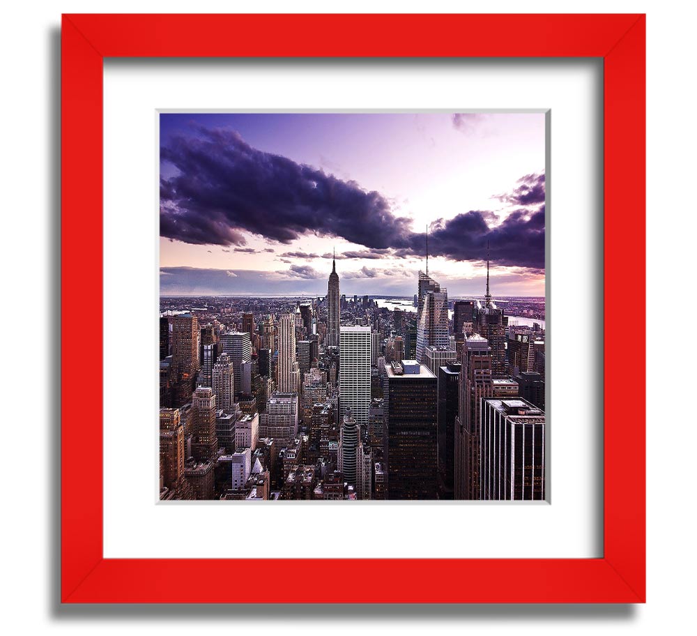 Aerial view of New York City skyline at dusk, framed in a stylish square frame, showcasing vibrant city lights.