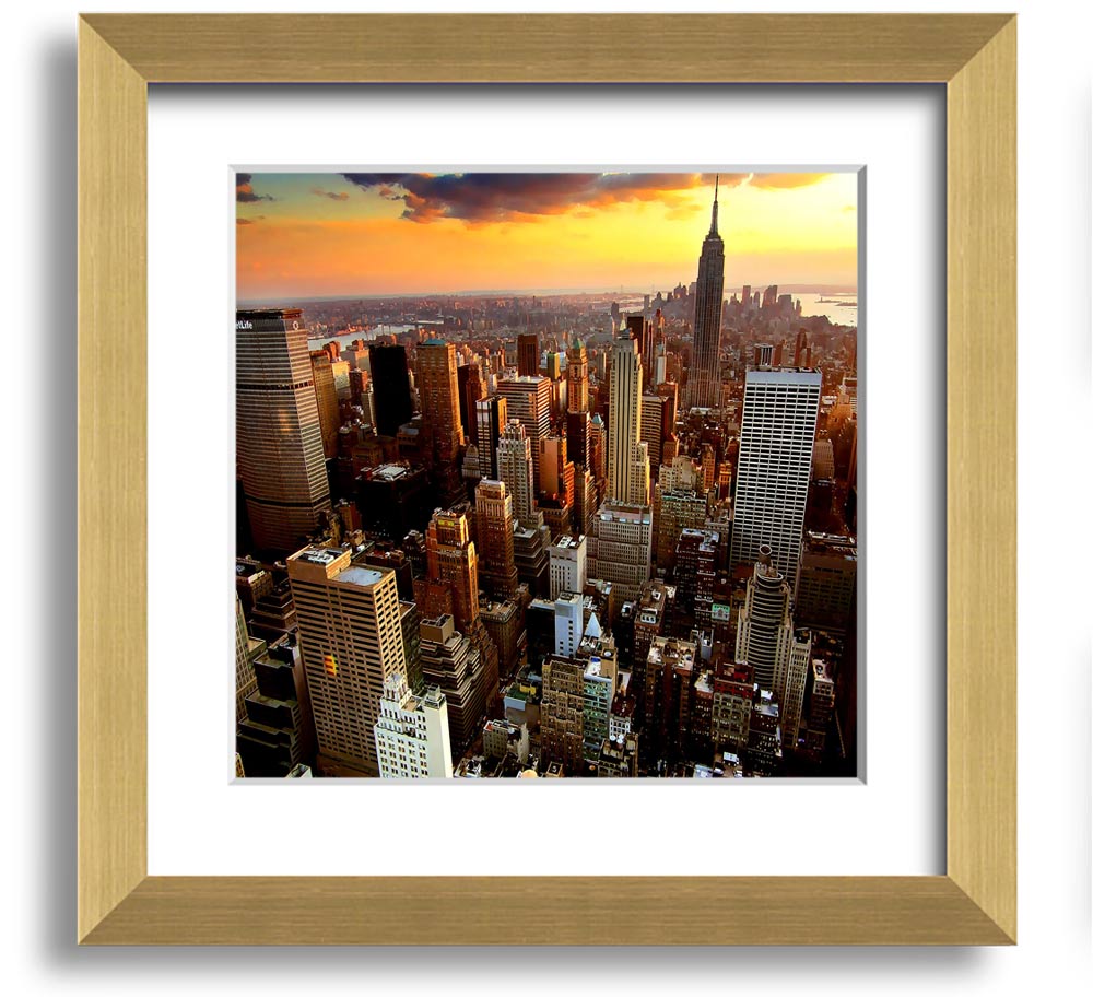 Aerial view of New York City at sunset, framed in a square frame, showcasing vibrant colors and iconic skyline.