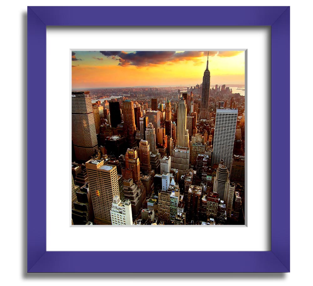 Aerial view of New York City at sunset, framed in a square frame, showcasing vibrant colors and iconic skyline.