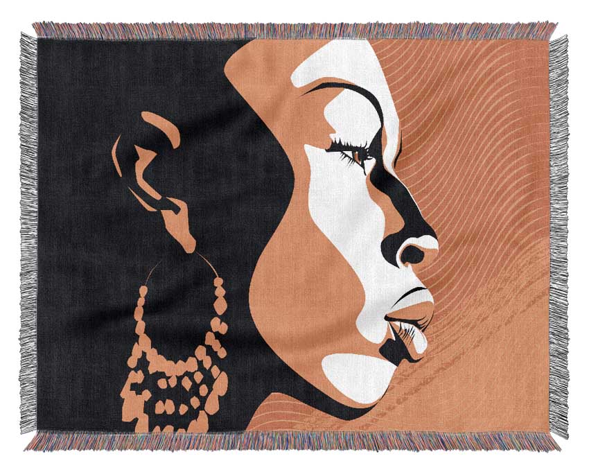A luxurious throw blanket featuring an African female design, bathed in golden light, showcasing intricate patterns and rich colors.