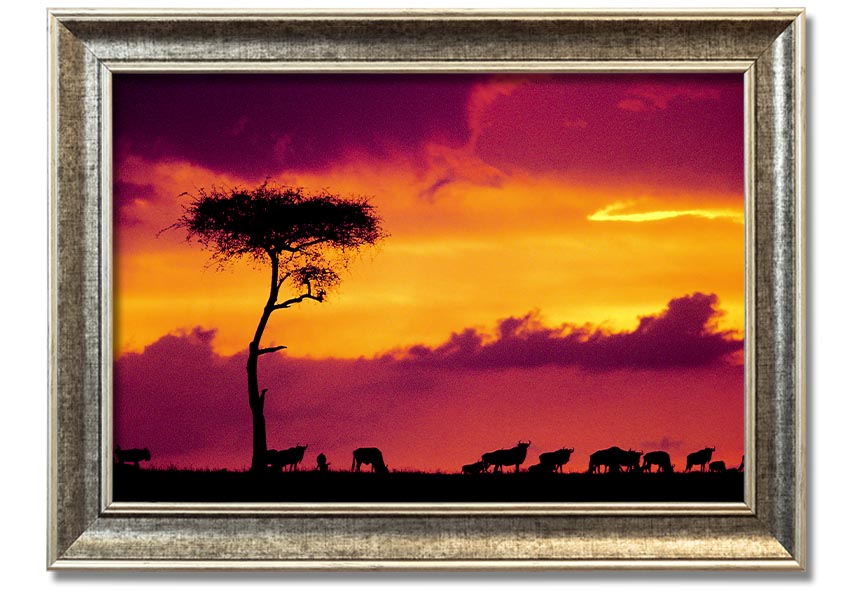 A beautifully framed print of an African sunset, showcasing vibrant colors and serene landscapes, ready to hang on the wall.