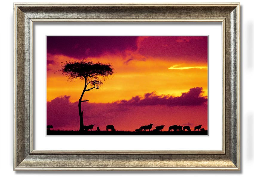A beautifully framed print of an African sunset, showcasing vibrant colors and serene landscapes, ready to hang on the wall.