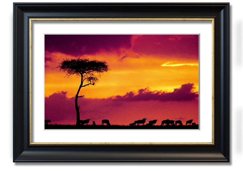A beautifully framed print of an African sunset, showcasing vibrant colors and serene landscapes, ready to hang on the wall.