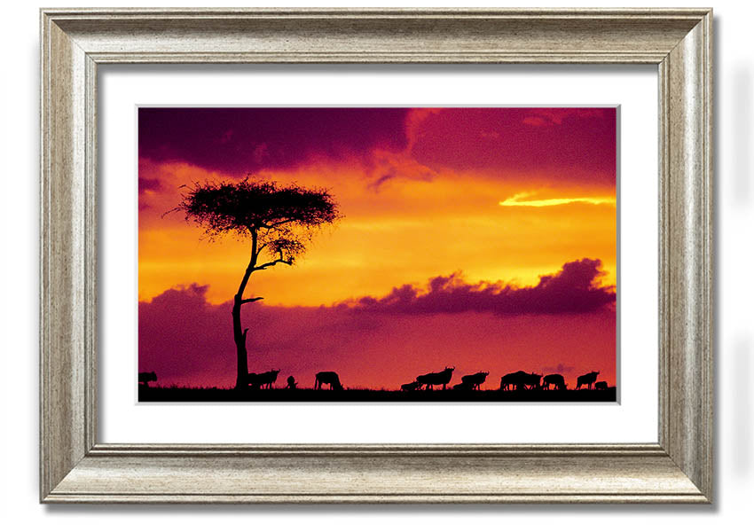 A beautifully framed print of an African sunset, showcasing vibrant colors and serene landscapes, ready to hang on the wall.