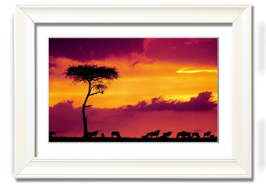 A beautifully framed print of an African sunset, showcasing vibrant colors and serene landscapes, ready to hang on the wall.