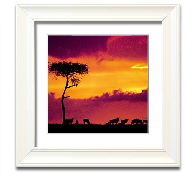 A beautifully framed print of an African sunset, showcasing vibrant colors and serene landscapes, ready to hang.